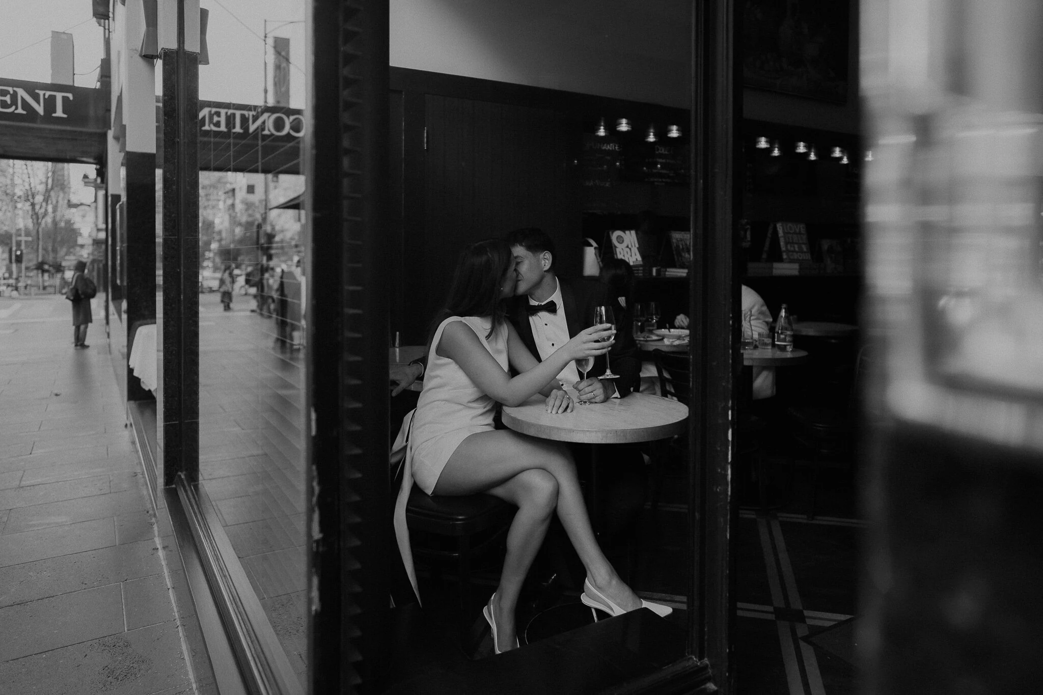 A couple sharing a quiet moment at a city cafe